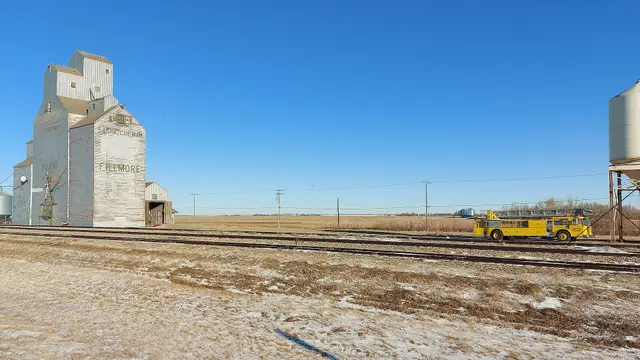 Grain elevator and fire truck by the tracks